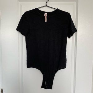 VS black short sleeve bodysuit with floral details